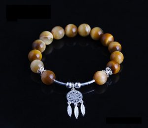 vòng đá mắt hổ vàng mix charm